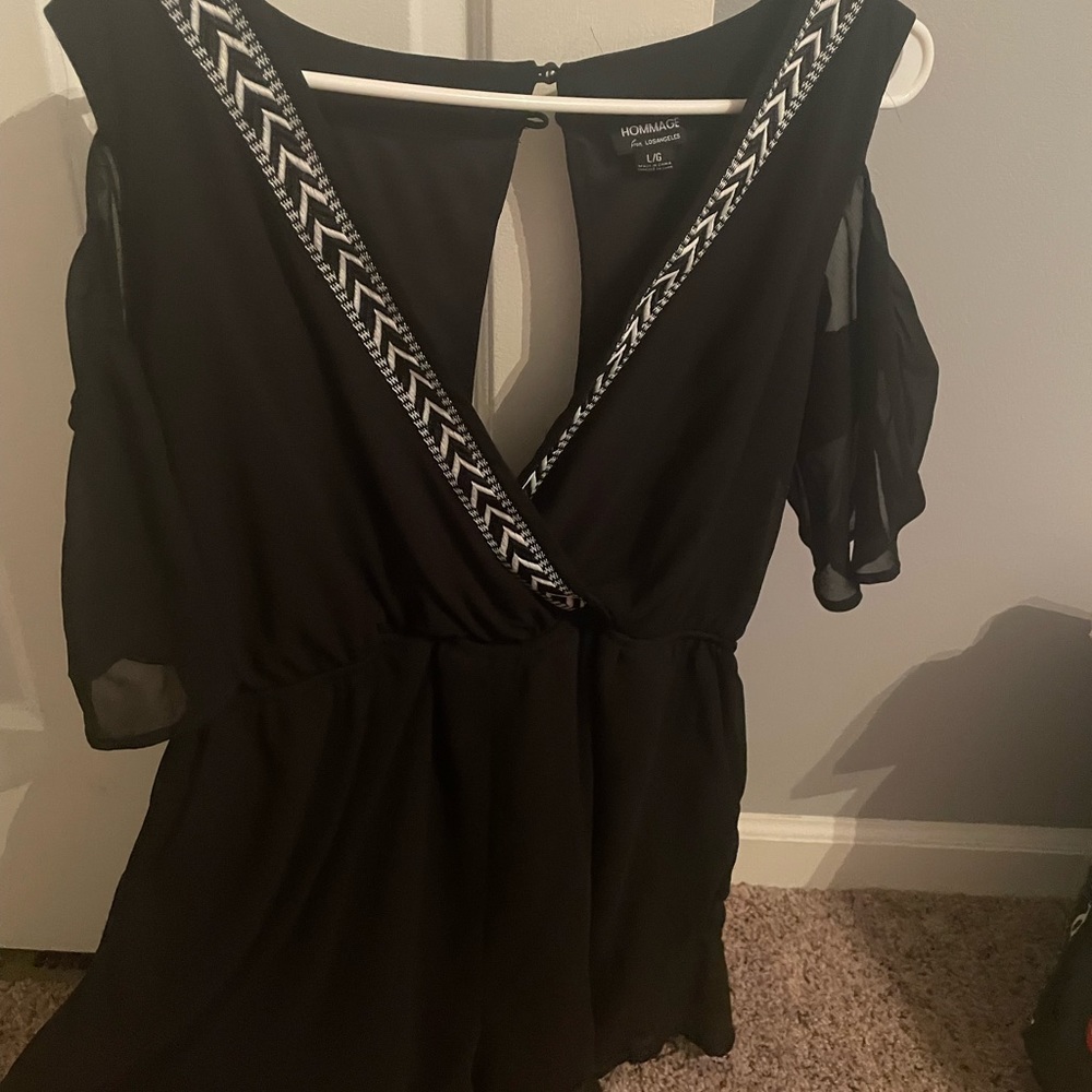 Black romper with peep hole shoulders from a small boutique!
